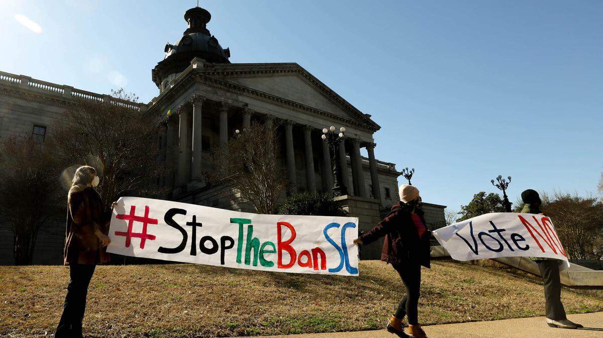 Demonstrators protest the fetal heartbeat anti-abortion bill outside the S.C Statehouse on Wednesday, Feb. 17, 2021, just before the Legislature passed the bill.