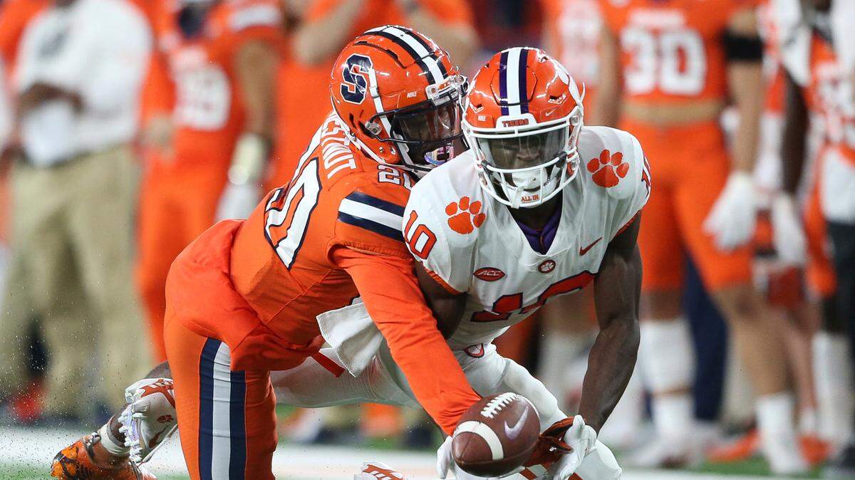 Syracuse defensive back Darian Chestnut (20) breaks up a pass intended for Clemson wide receiver Joseph Ngata (10) during the third quarter of an NCAA football game in Syracuse, N.Y., Friday, Oct. 15, 2021. (AP Photo/Joshua Bessex)