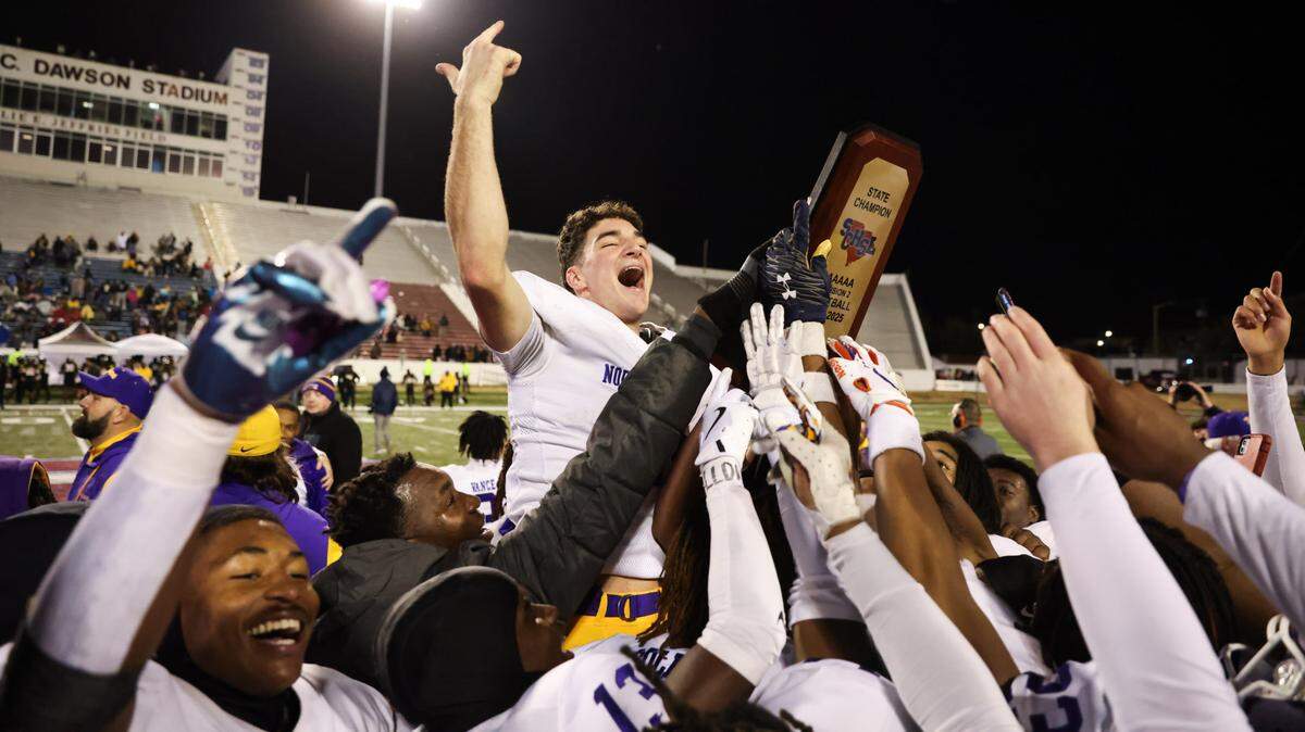 Finley Polk (10) of Northwestern celebrates with teammates following their win over Irmo in the Class 5A-D2 football state championship game at Oliver Dawson Stadium in Orangeburg on Saturday, December 14, 2024.
