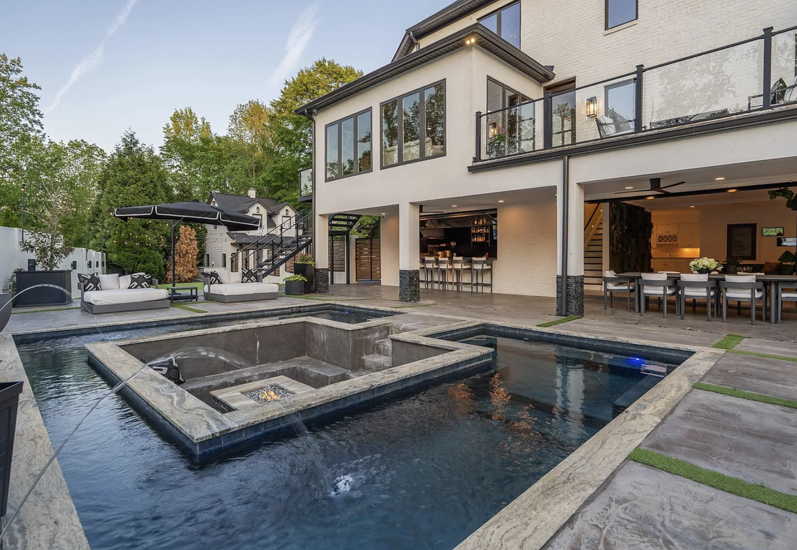 The estate has two pools. This one is heated saltwater with a fire pit and a cabana.
