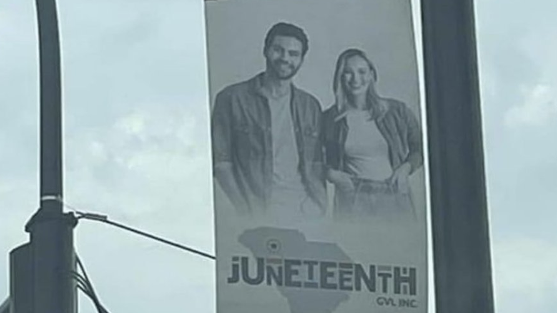 This banner on Greenville’s Main Street has raised questions about showing a white couple to celebrate a federal holiday commemorating the freeing enslaved Americans.