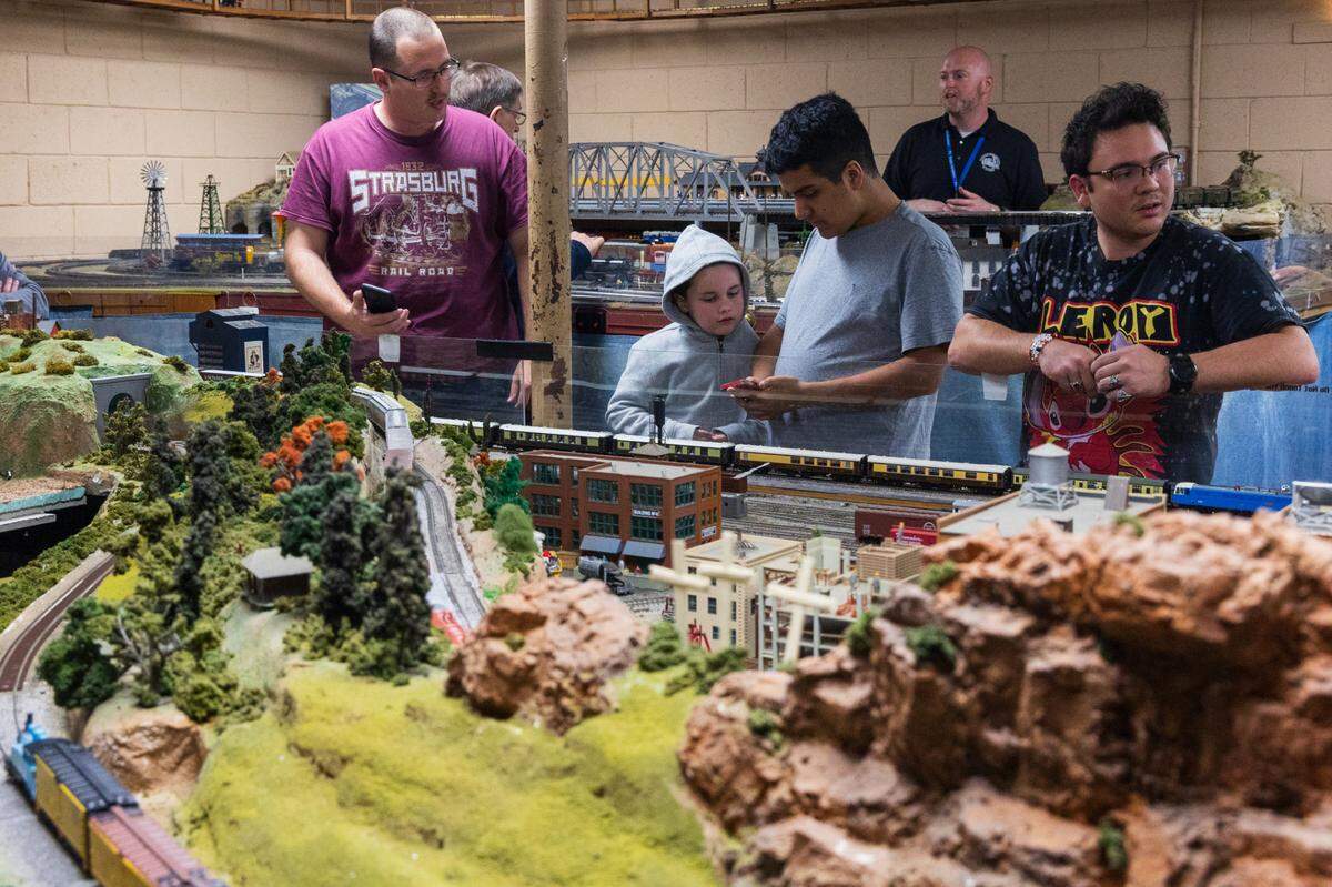 Model railroad enthusiasts show how to control model trains using a phone app at the Associated Model Railroads of Columbia, a club that meets Thursdays at 1800 Lincoln Street in Columbia, South Carolina, on Thursday, March 20, 2025.