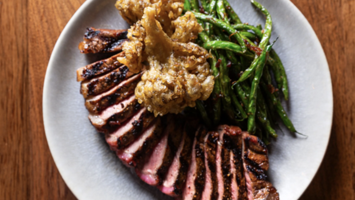  Bourbon-Soy Glazed NY Strip is one of the items on South Main Social’s menu.