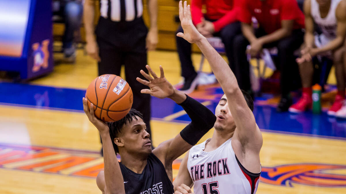 Sunrise Christian Buffaloes forward Jordan Turner (5) shoots over The Rock School Lions forward Dardan Kapiti (15) during the 2018 Chick-fil-A Classic at Richland Northeast High School.