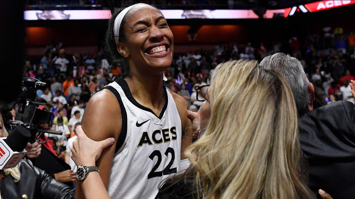 Las Vegas Aces head coach Becky Hammon, right, celebrates with Las Vegas Aces’ A’ja Wilson after their win in the WNBA basketball finals against the Connecticut Sun, Sunday, Sept. 18, 2022, in Uncasville, Conn. (AP Photo/Jessica Hill)