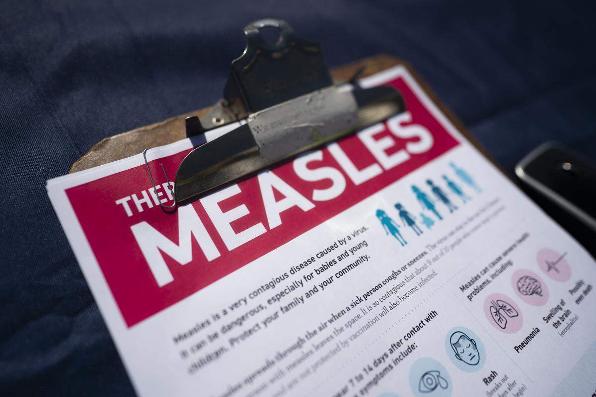 SPARTANBURG, SOUTH CAROLINA - FEBRUARY 6: A fact sheet for measles sits on a table at a mobile clinic offering free vaccinations on February 6, 2026 in Spartanburg, South Carolina. The clinic offered free MMR vaccinations as the South Carolina Department of Health reported 876 cases of measles earlier in the week, most centered in Spartanburg County. (Photo by Sean Rayford/Getty Images)