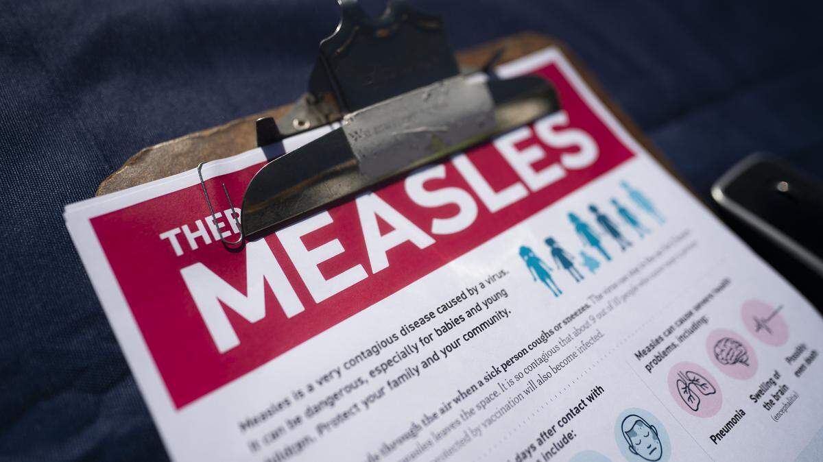 SPARTANBURG, SOUTH CAROLINA - FEBRUARY 6: A fact sheet for measles sits on a table at a mobile clinic offering free vaccinations on February 6, 2026 in Spartanburg, South Carolina. The clinic offered free MMR vaccinations as the South Carolina Department of Health reported 876 cases of measles earlier in the week, most centered in Spartanburg County. (Photo by Sean Rayford/Getty Images)