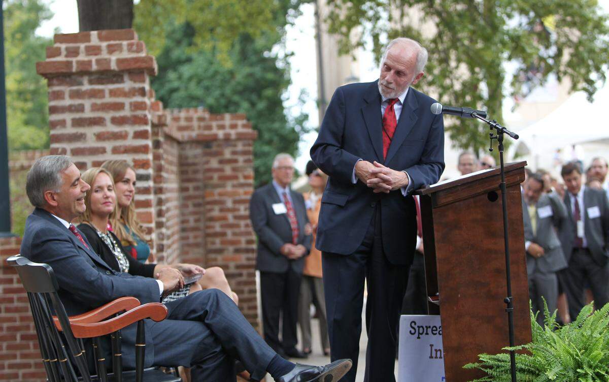 Charles Bierbauer, dean of the College of the Information and Communications at USC, has fun with USC president Harris Pastides during the dedication of the school's new journalism building. 9/16/15