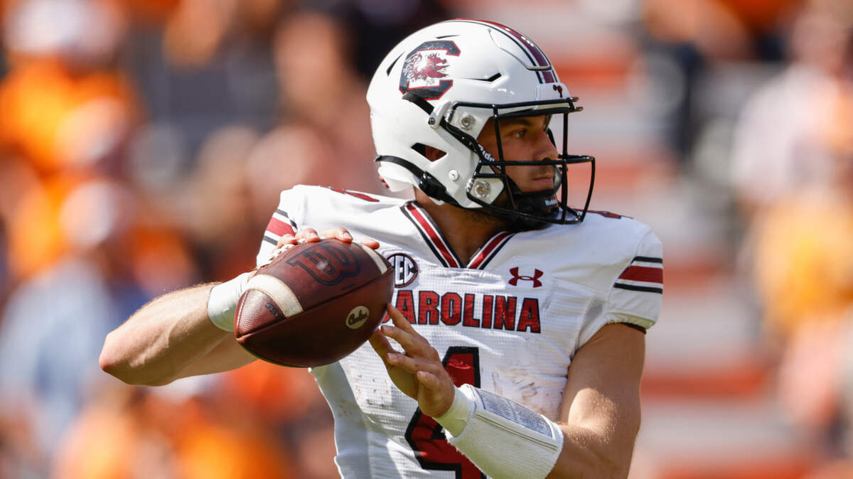 South Carolina quarterback Luke Doty (4) throws to a receiver during the first half of an NCAA college football game against Tennessee, Saturday, Oct. 9, 2021, in Knoxville, Tenn. (AP Photo/Wade Payne)