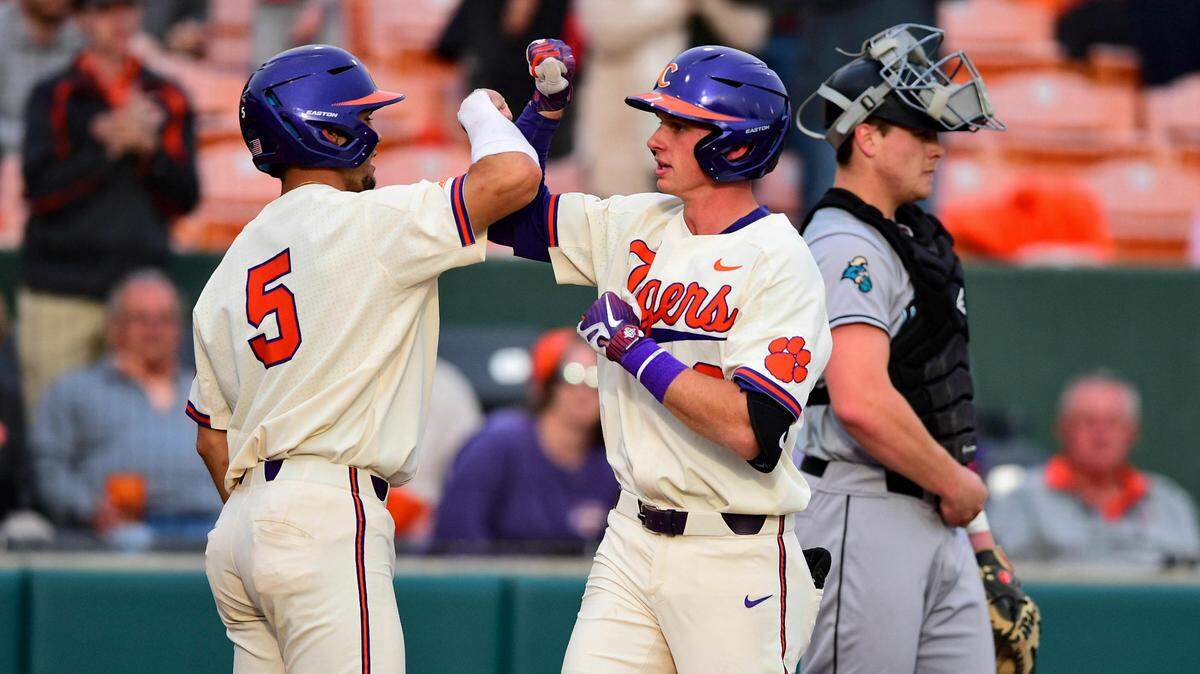 Clemson’s Logan Davidson, right, celebrates a homerun with Sam Hall during an NCAA college baseball game, Wednesday, March 13, 2019, in Clemson, S.C. (AP Photo/Richard Shiro)