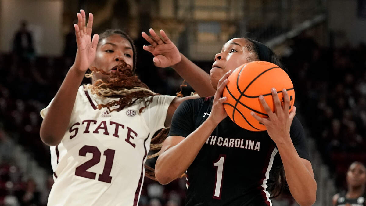 South Carolina guard Zia Cooke (1) attempts a layup while Mississippi State guard Debreasha Powe (21) defends during the first half of an NCAA college basketball game in Starkville, Miss., Sunday, Jan. 8, 2023. (AP Photo/Rogelio V. Solis)