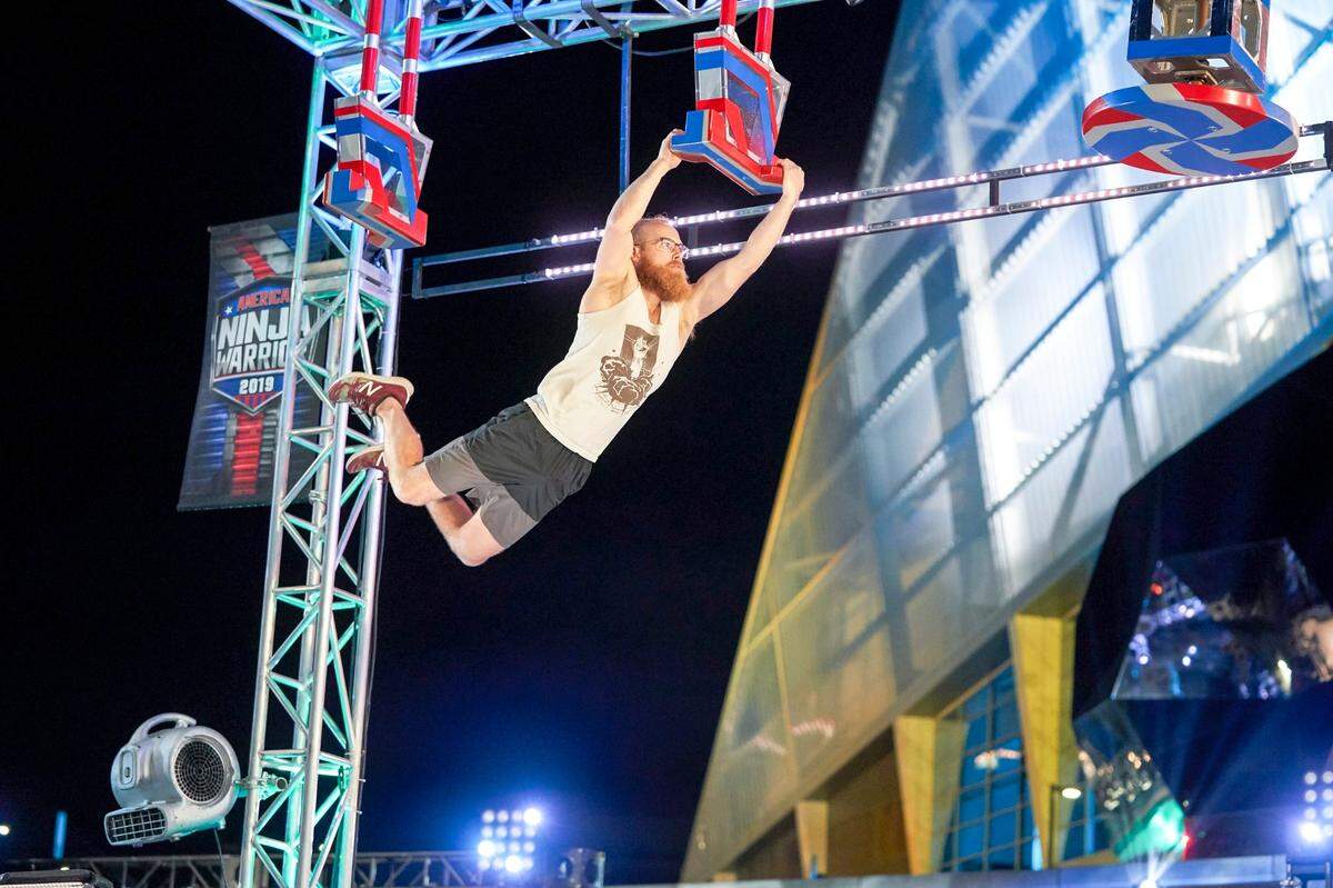 Brett Sims competes in season 11 of “American Ninja Warrior.” The reality show has aired on NBC for 14 seasons.