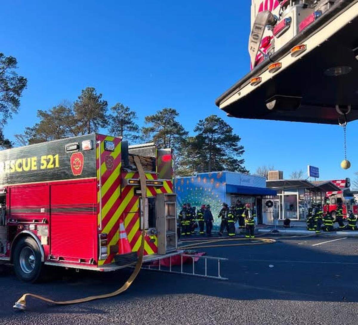 Firefighters respond to a burning building.