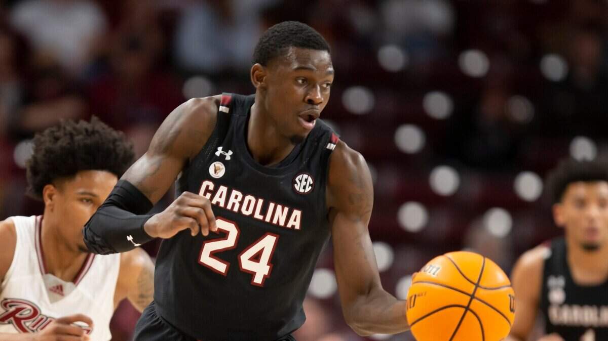 Keyshawn Bryant brings the ball up the court as Corey McKeithan of Rider University gives chase during the Gamecocks’ game against the visiting Broncs at Colonial Life Arena on Sunday, November 28, 2021.