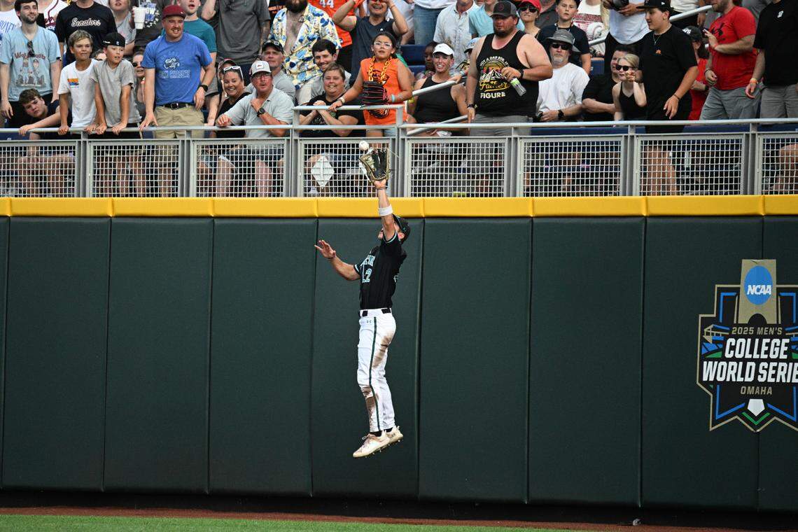 Coastal Carolina Chanticleers right fielder Blagen Pado (22) catches a fly ball against the Oregon State Beavers during the third inning at Charles Schwab Field.