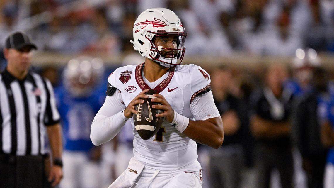 Sep 28, 2024; Dallas, Texas, USA; Florida State Seminoles quarterback DJ Uiagalelei (4) rolls back to pass against the Southern Methodist Mustangs during the second quarter at Gerald J. Ford Stadium.