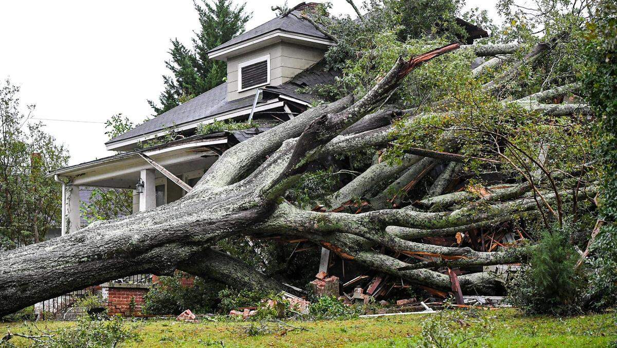 A large oak lies on a home after it fell due to Tropical Storm Helene in Anderson, South Carolina, U.S., September 27, 2024.