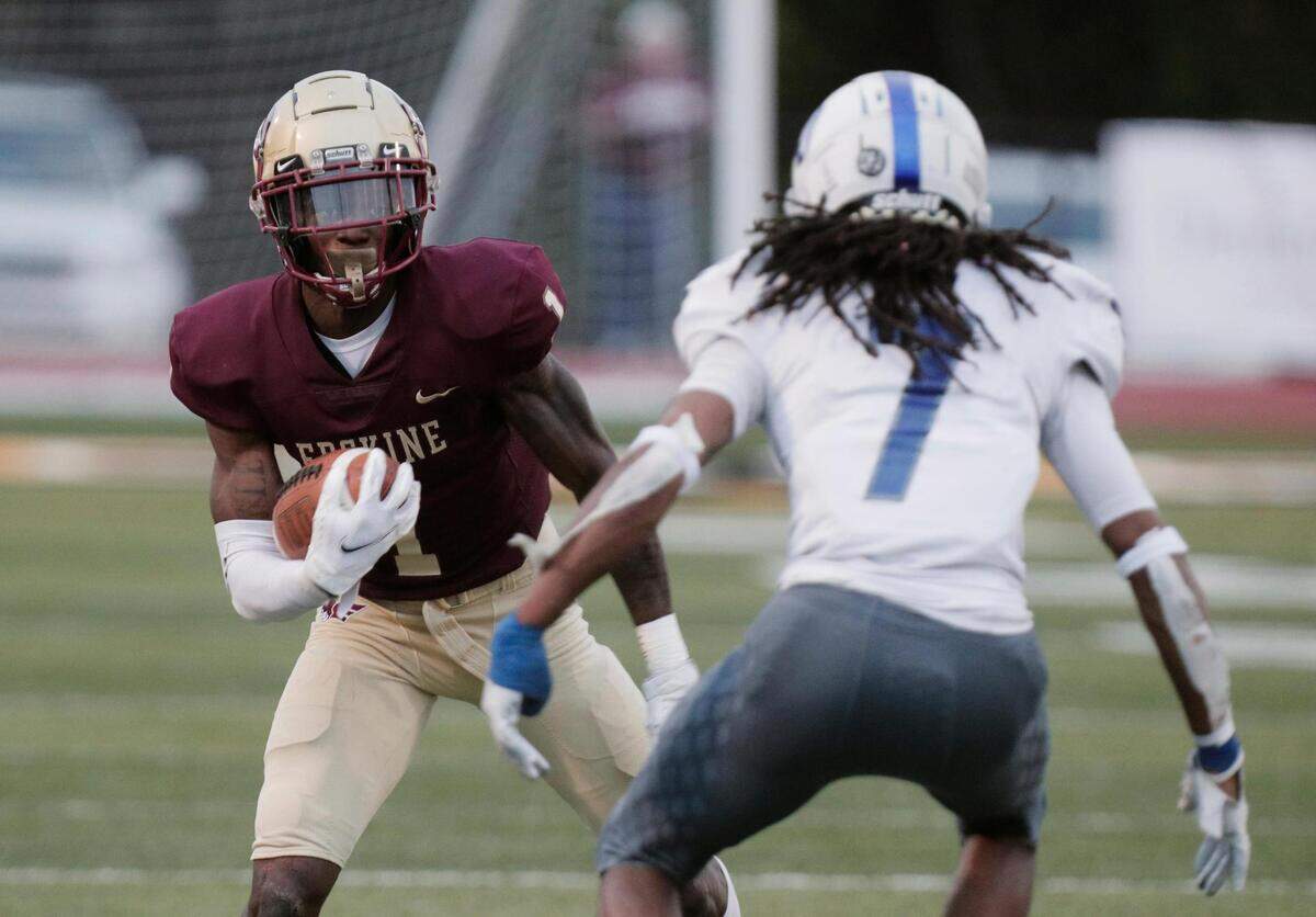 Erskine College’s Senika McKie 1 tries to shake Shorter University’s Jeff Brewer Jr. 7 on Saturday, March 13, 2021.