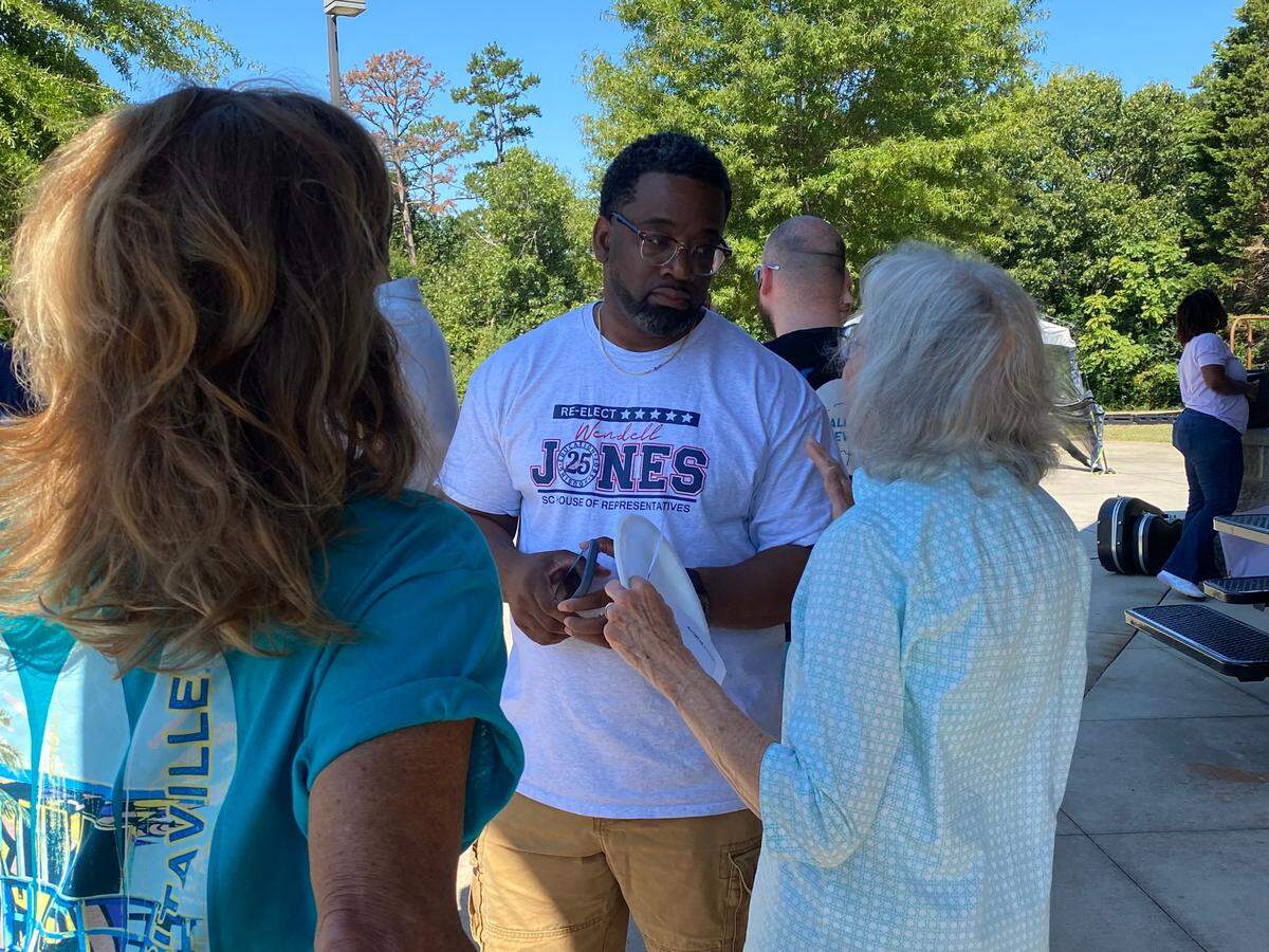 State Rep. Wendell Jones, D-Greenville, speaks to a Greenville County Democratic Party supporter at the party’s candidate cookout on Saturday, Sept. 7, 2024.