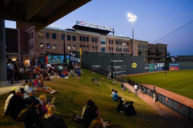 People enjoy watching baseball at Fluor Field during the Greenville Drive game on Wednesday, April 12, 2023.