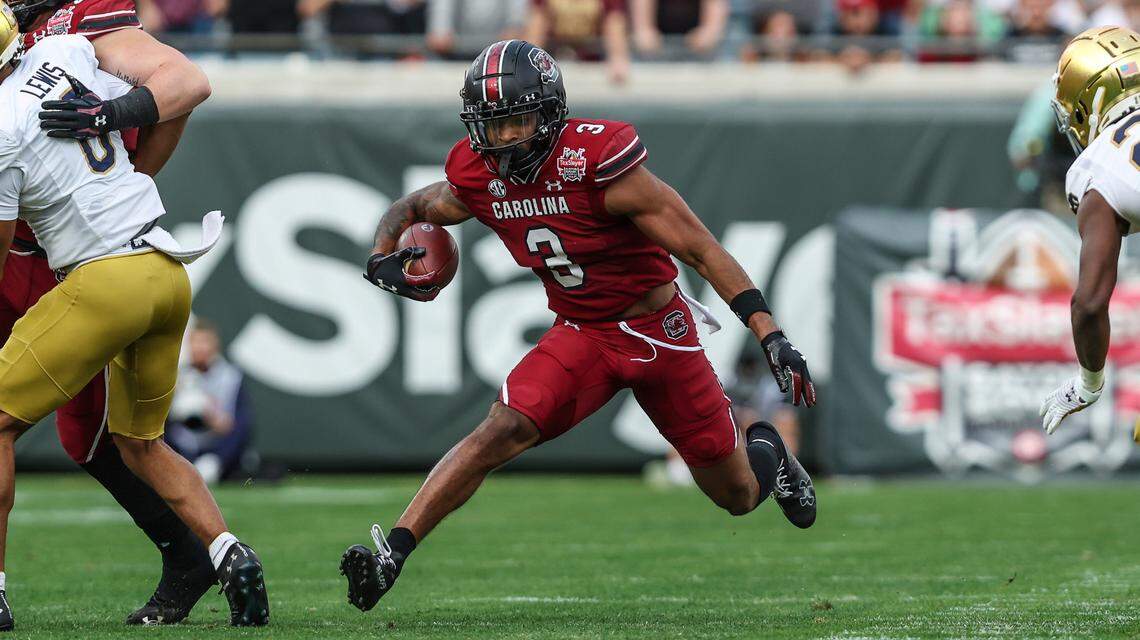 South Carolina wide receiver Antwane Wells Jr. (3) runs the ball after a catch for a first down during the first quarter of the Gator Bowl NCAA college football game against Notre Dame on Friday, Dec. 30, 2022, in Jacksonville, Fla. (AP Photo/Gary McCullough)