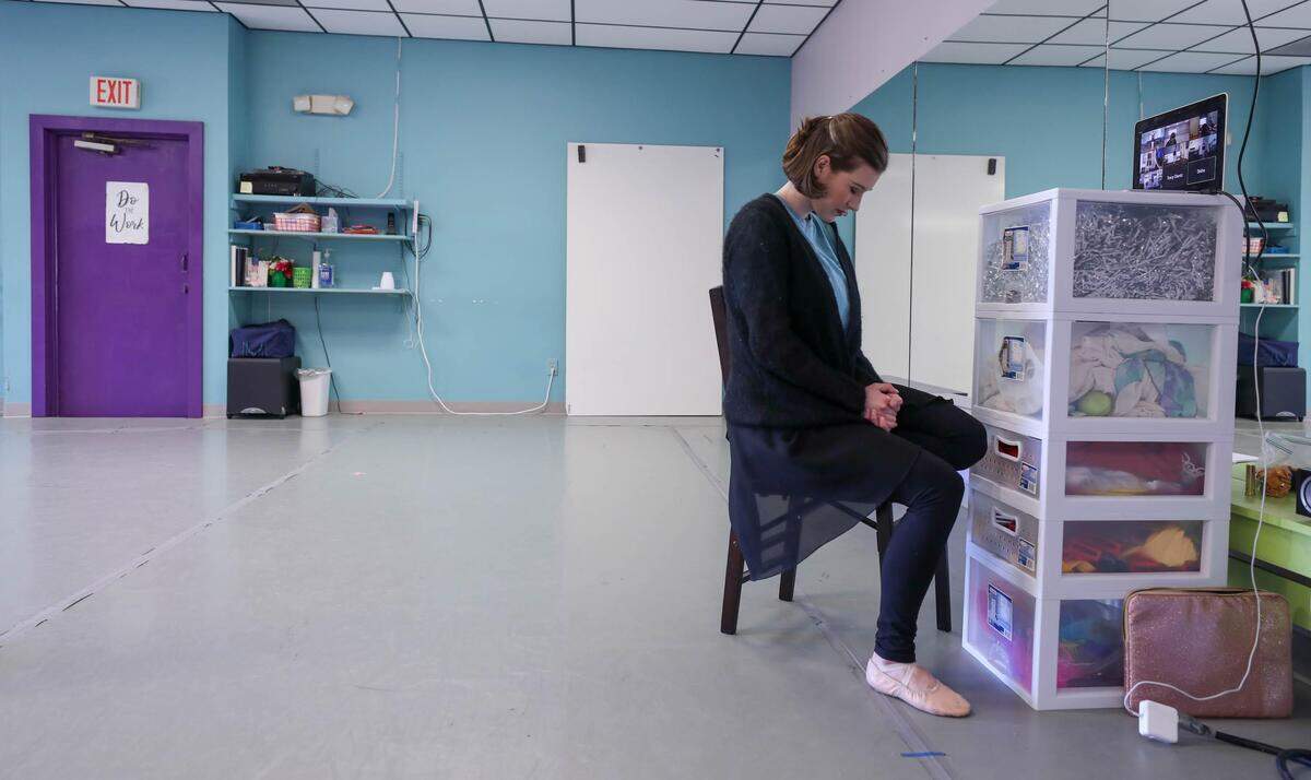 Carolina Douglas Bliss prays with her dance students before teaching a class at the South Carolina Christian Dance Theater in Irmo. Due to the coronavirus, Bliss and other teachers are connecting with their students through video, via the internet.