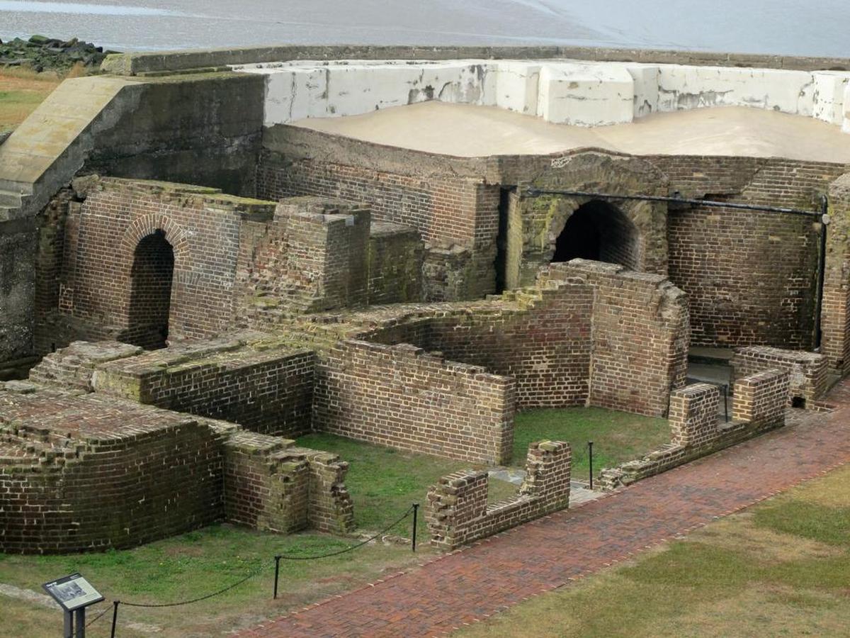 Several shells are lodged in a wall of Fort Sumter, where the Civil War began. They are being conserved in place because removing them would damage both the shells and the masonry around them.