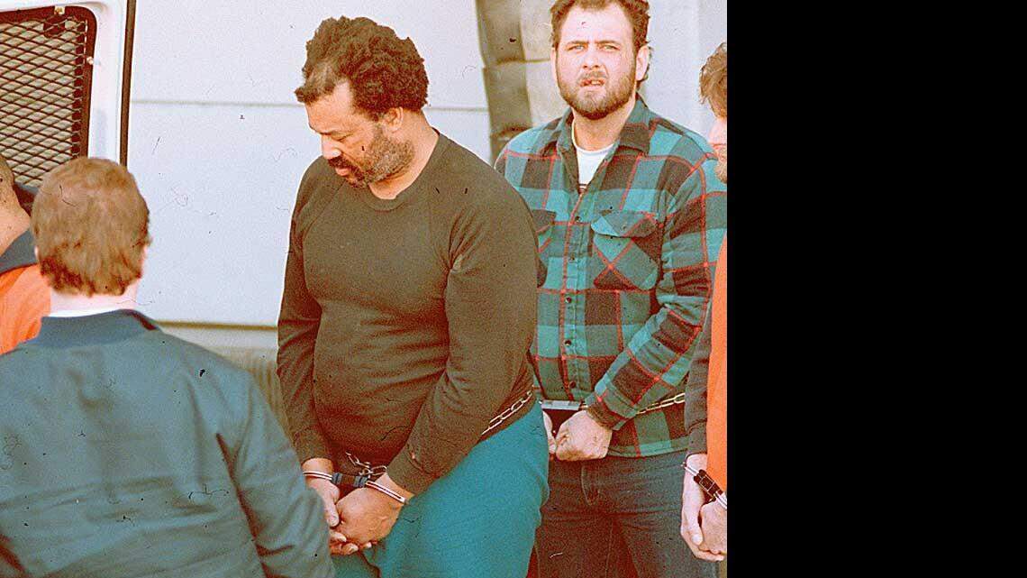 Willie Aikens walks to a law enforcement vehicle after his arrest on March 1, 1994, for federal drug and firearms charges. At the time, he weighed 308 pounds.