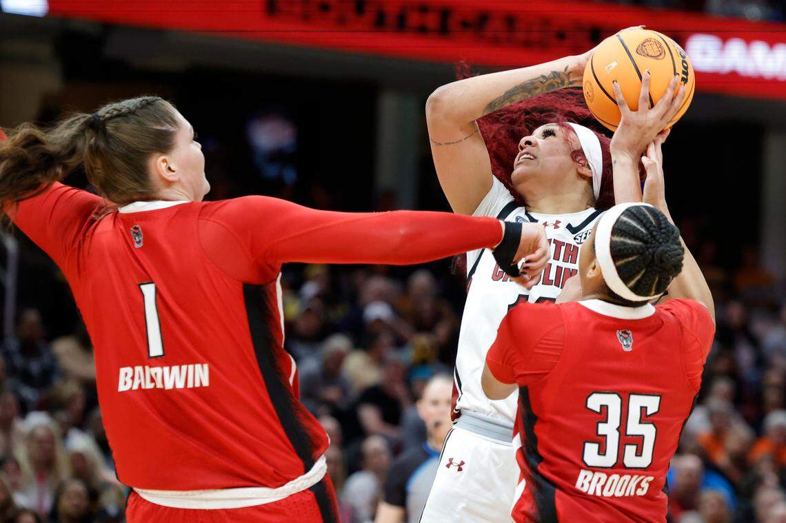South Carolina’s Kamilla Cardoso (10) looks to shoot as NC State’s River Baldwin (1) and Zoe Brooks (35) pressure during the Final Four game at Mortgage FieldHouse in Cleveland, Ohio on Friday April 5, 2024.