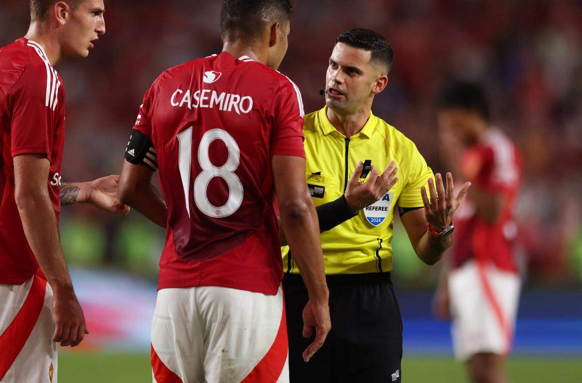 Manchester United midfielder Casemiro (18) speaks with a referee during the Rivals in Red International Friendly soccer match between Manchester United and Liverpool in Columbia on Saturday, August 3, 2024.