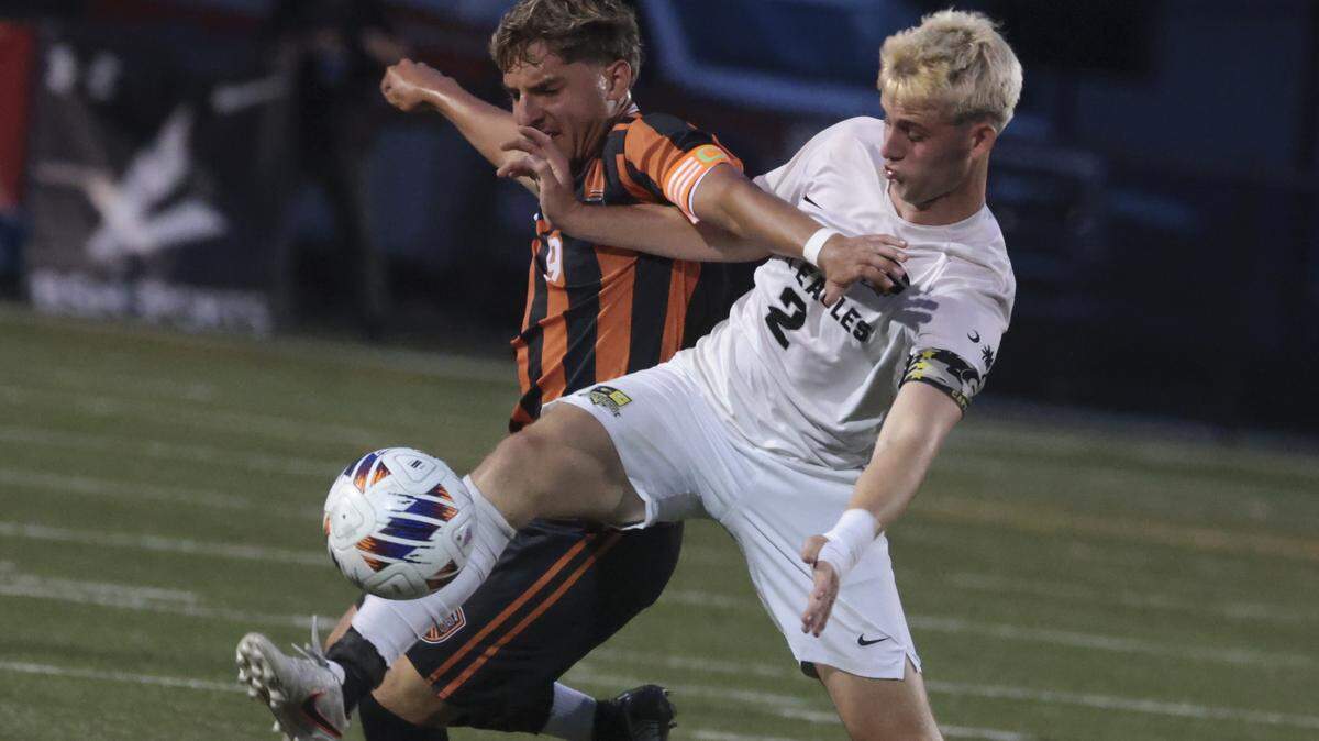 Gray Collegiate's Will Webber (2) keeps the ball from Southside's Adriel Rodriguez (9) during the state championship game on Friday, May 22, 2026, at Memorial Stadium in Columbia, South Carolina.