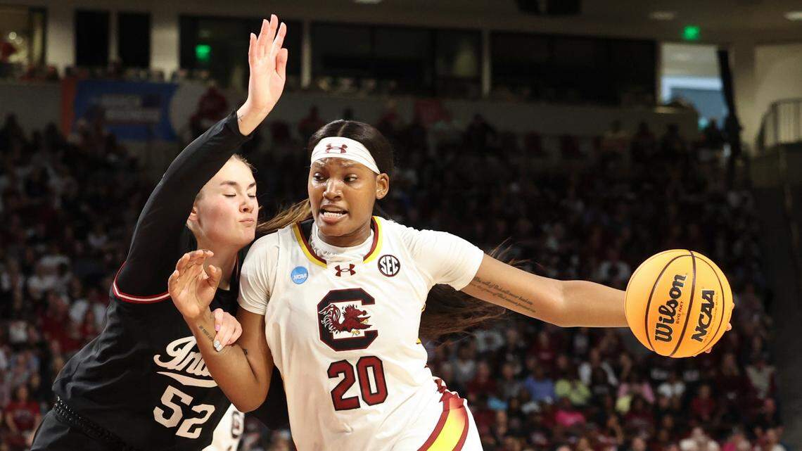 University of South Carolina’s Sania Feagin (20) drives the Balla round Indiana University’s Lilly Meister (52) during the first half of action in the Second Round game of the NCAA Tournament at the Colonial Life Arena on Sunday, March 23, 2025.