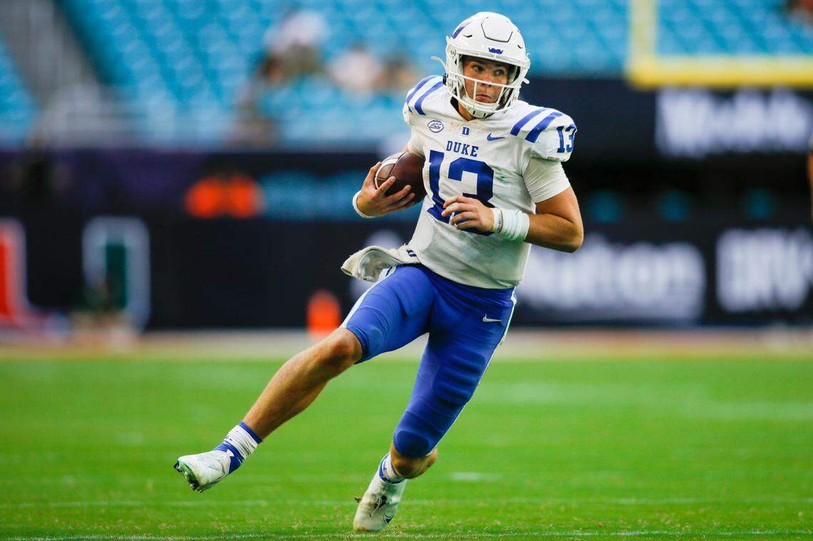 Oct 22, 2022; Miami Gardens, Florida, USA; Duke Blue Devils quarterback Riley Leonard (13) runs with the football during the fourth quarter against the Miami Hurricanes at Hard Rock Stadium. Mandatory Credit: Sam Navarro-USA TODAY Sports
