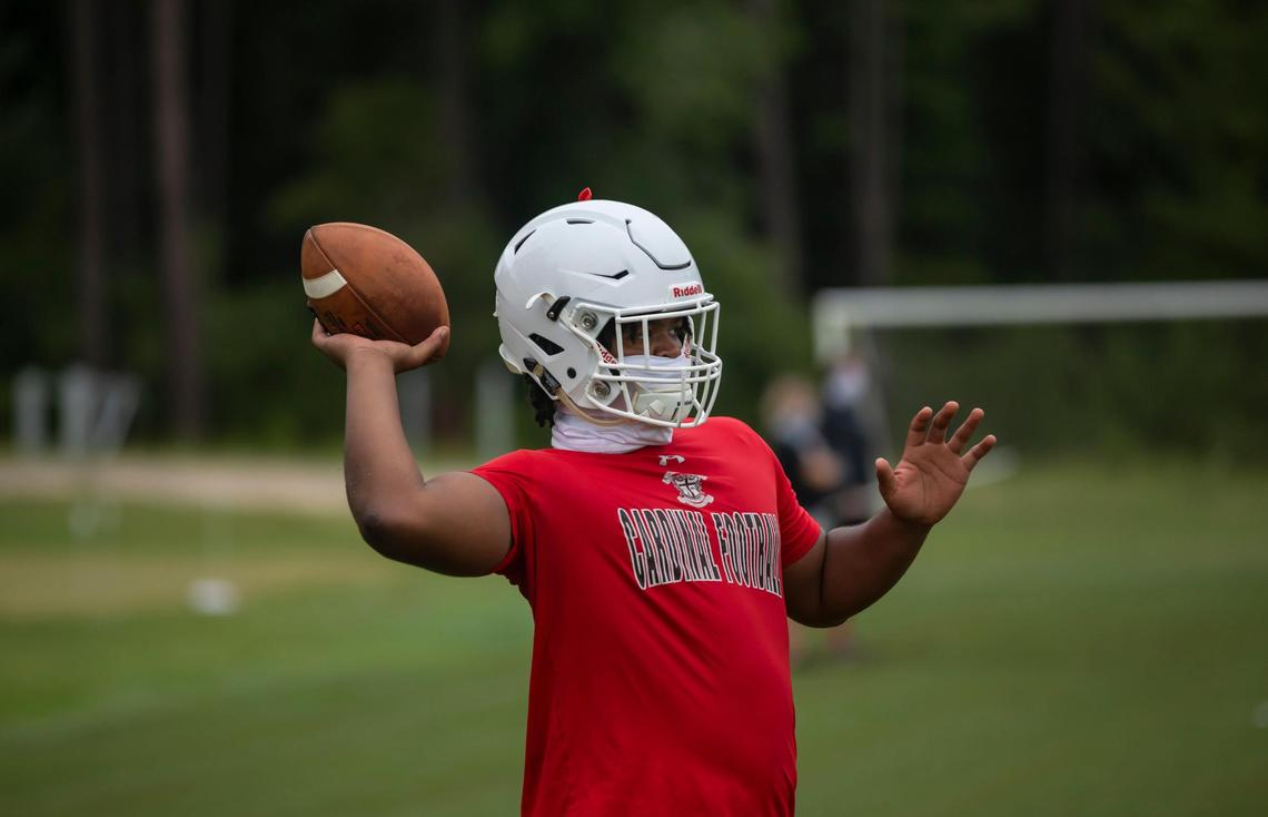 Shanye Monsanto tosses the ball back after running a play during practice at Cardinal Newman School on August 4, 2020.