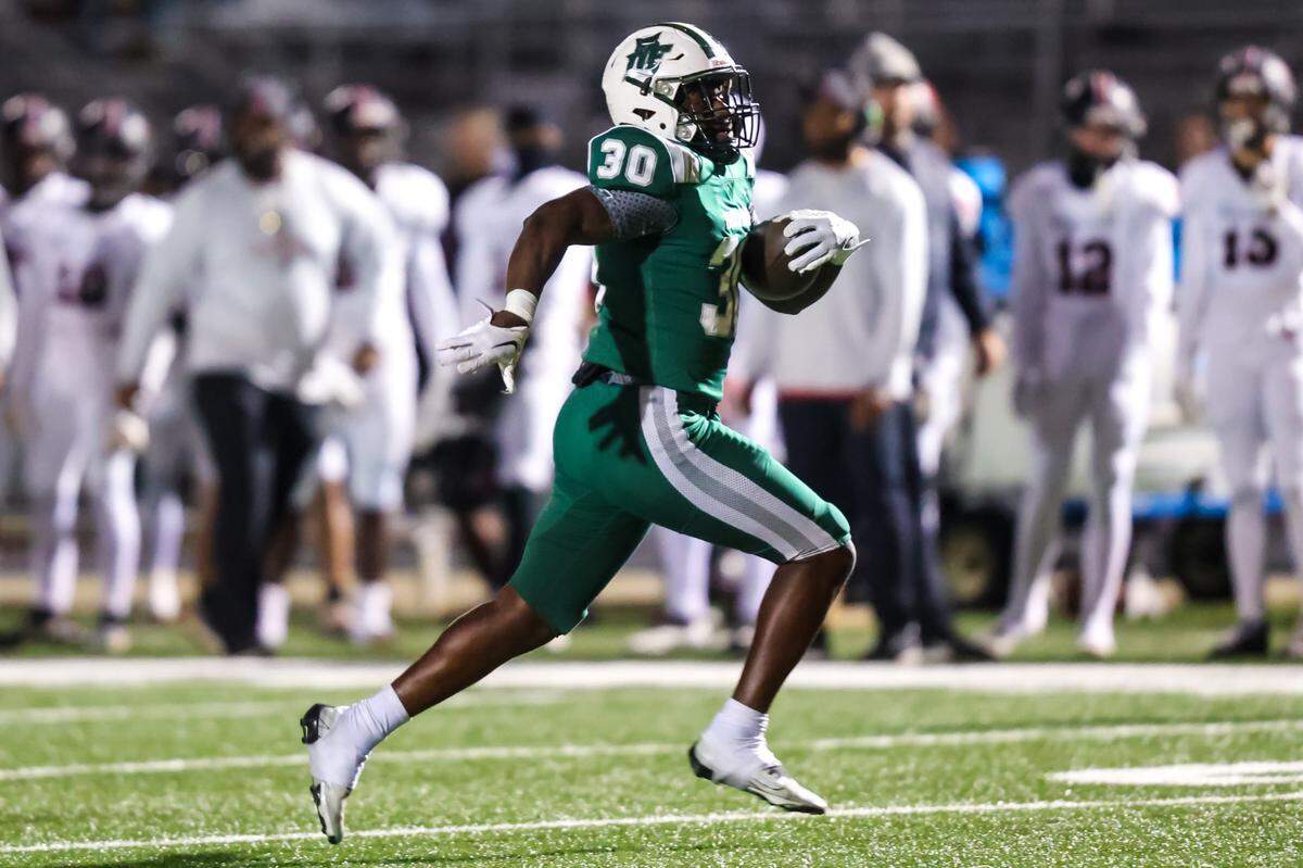 Dutch Fork Silver Foxes running back Maurice Anderson (30) rushes for a touchdown against the Boiling Springs Bulldogs in their first round 5A Upper State playoff game at Dutch Fork High School Friday, November 3, 2023.