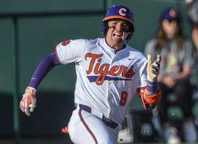 Clemson infielder Josh Paino (8) hits a double against Winthrop University during the bottom of the first inning at Doug Kingsmore Stadium in Clemson, S.C. Wednesday, February 25, 2025.