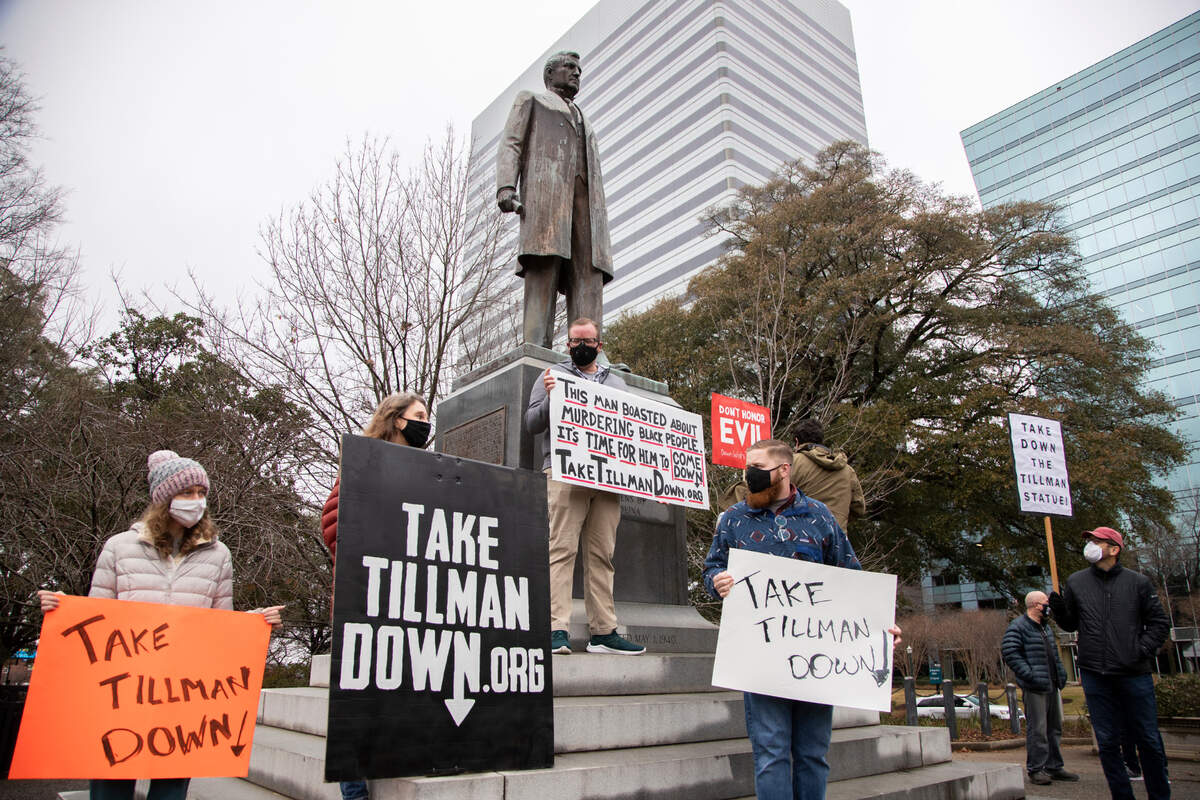 Protestors advocate for removing the statue of Benjamin Tillman and repeal of the Heritage Act at the South Carolina State House on Tuesday, January 12, 2021. Tillman was governor of South Carolina from 1890 until 1894, and lead a paramilitary group on a campaign of racist terror across South Carolina.