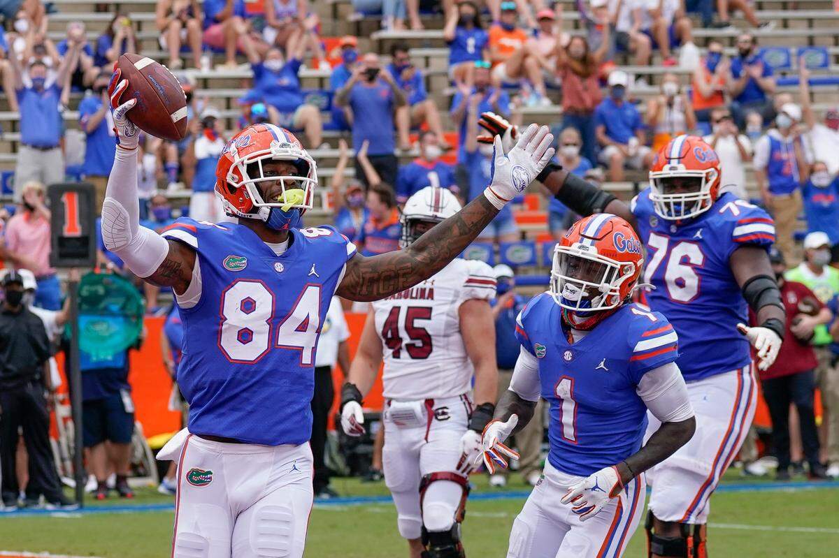 Florida tight end Kyle Pitts (84) will likely have already been picked by the time the Panthers’ No. 8 overall draft choice comes up. If he isn’t though, former Carolina star tight end Wesley Walls believes the team should take him.
