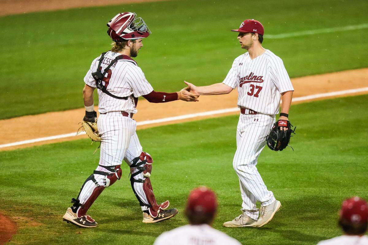 South Carolina pitcher Chris Veach (37) and catcher catcher Cole Messina (19) celebrate the win following the game between the South Carolina Gamecocks and the Penn Quakers on Friday, 2/24/23 at Founders Park in Columbia, SC.