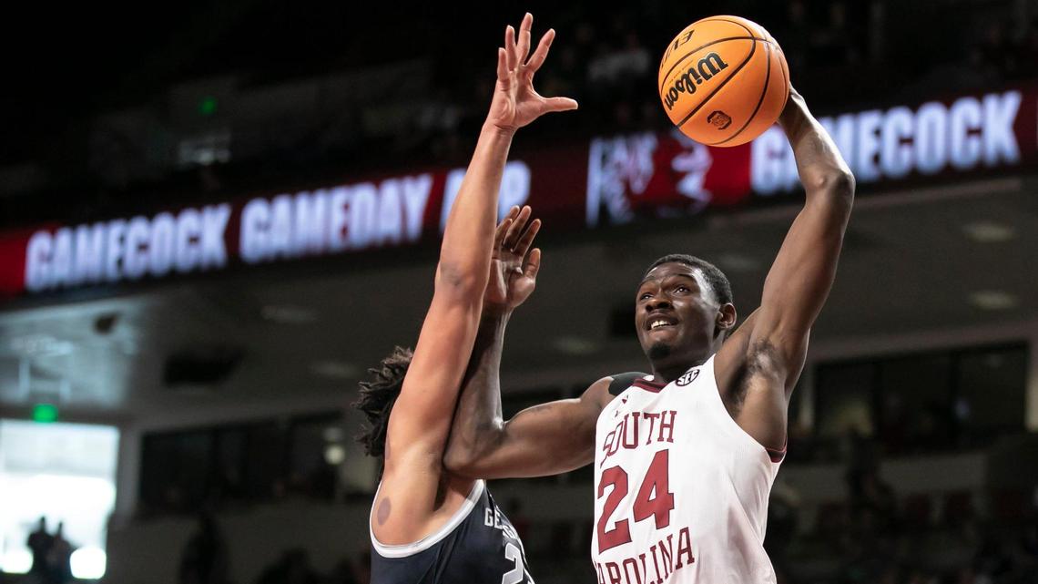 Keyshawn Bryant of USC drives past Collin Holloway of Georgetown during the Gamecocks’ game against the visiting Hoyas at Colonial Life Arena on Sunday, December 5, 2021.