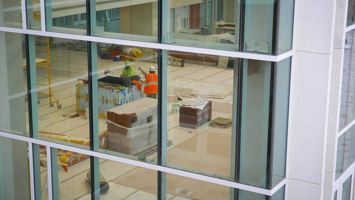 Workers talk on the first floor of the new Lexington Medical Center North Tower. The expansion, a 10-story, $400 million project, will give the overcrowded and aged facility more room to accommodate a growing Lexington County population.