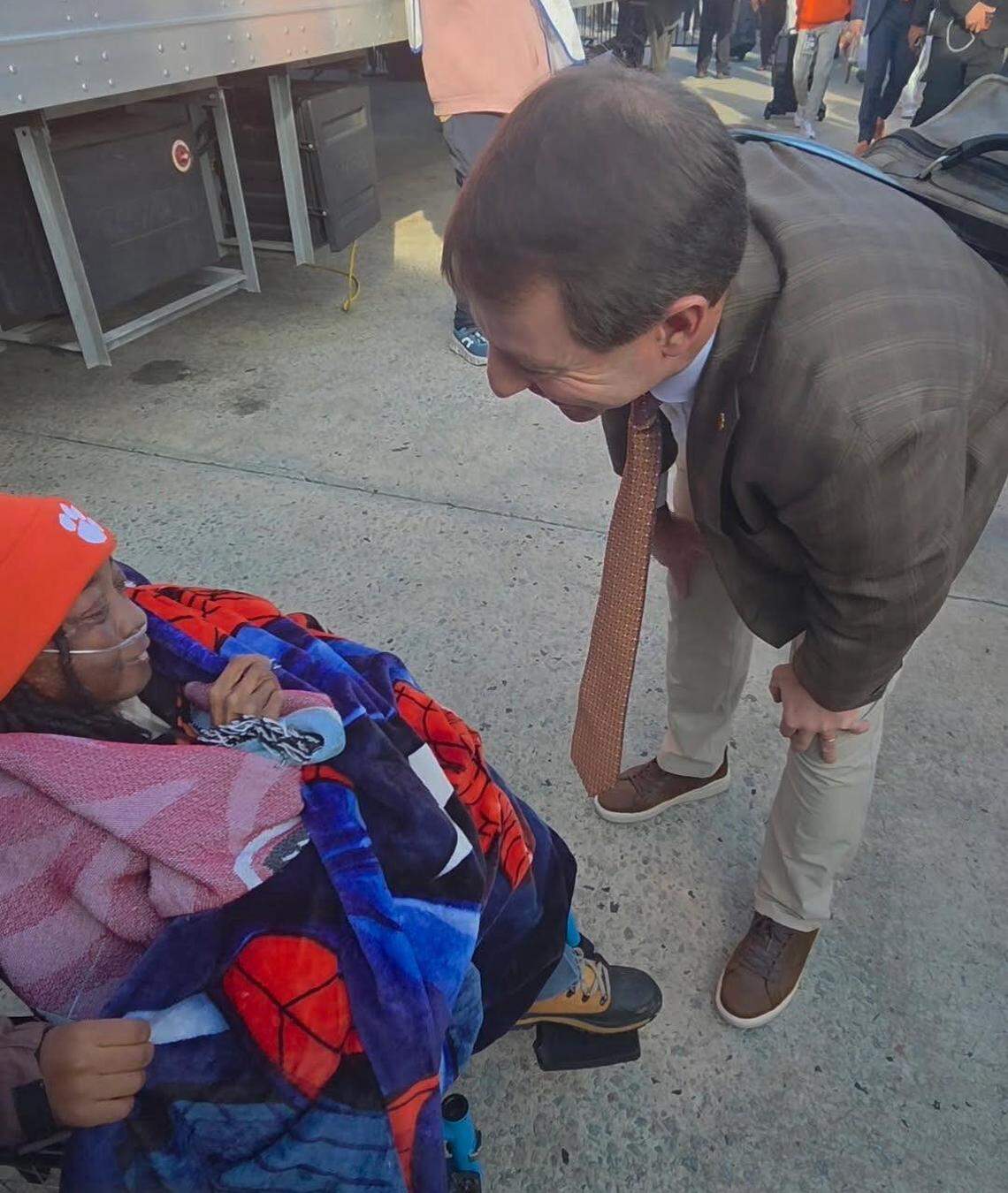 Clemson football coach Dabo Swinney (right) visits with 23-year-old cancer survivor and Clemson fan Tron Foster (left) on Saturday morning before the Clemson-USC football game