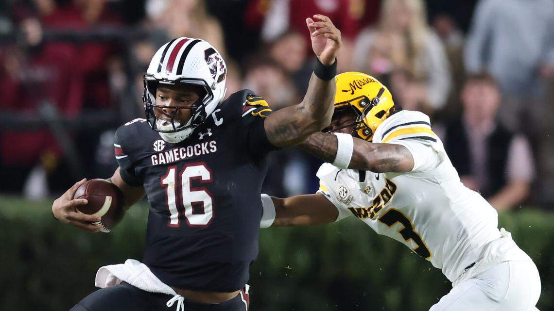 South Carolina quarterback LaNorris Sellers (16) carries the ball as Missouri safety Sidney Williams (3) attempts to grab ahold of him during the Gamecocks’ game against Missouri at Williams-Brice Stadium in Columbia on Saturday, November 16, 2024.