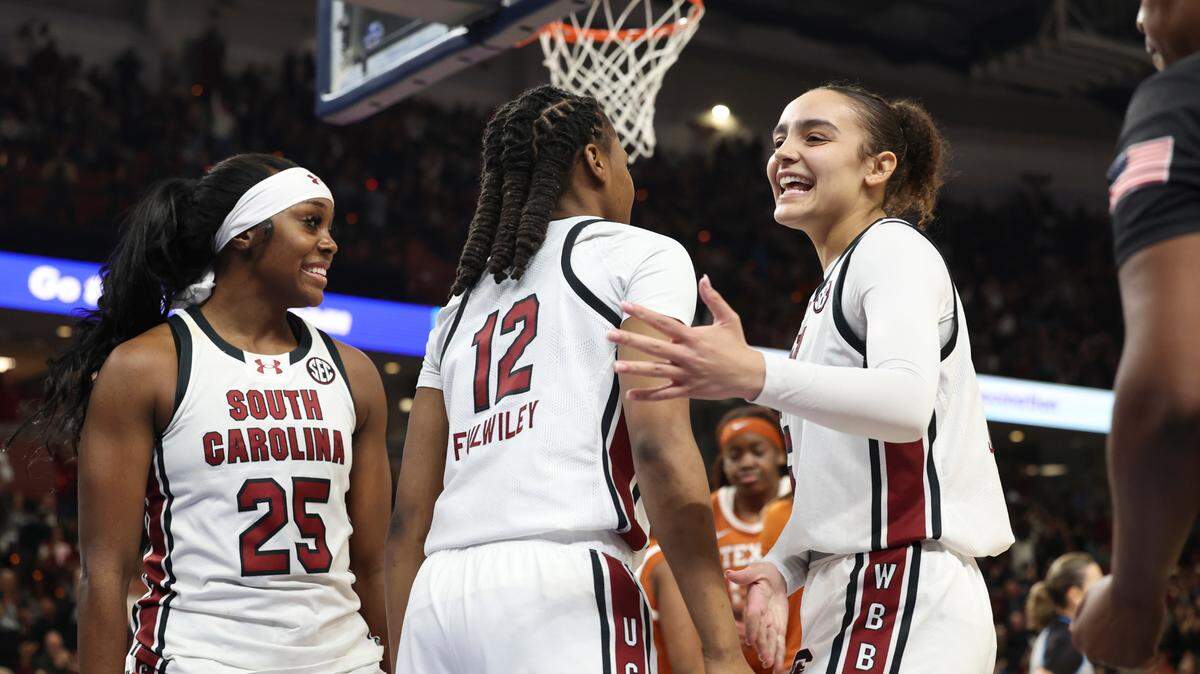 University of South Carolina’s MiLaysia Fulwiley (12) and University of South Carolina’s Tessa Johnson (5) celebrate during the second half of action against Texas in the SEC Tournament at the Bon Secours Wellness Arena in Greenville on Sunday, March 9, 2025.