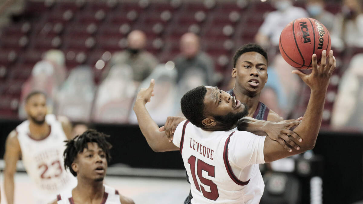 South Carolina Gamecocks forward Wildens Leveque (15) defends against Texas A&M Aggies guard Jaxson Robinson (4) at Colonial Life Arena on Wednesday, January 6, 2021.