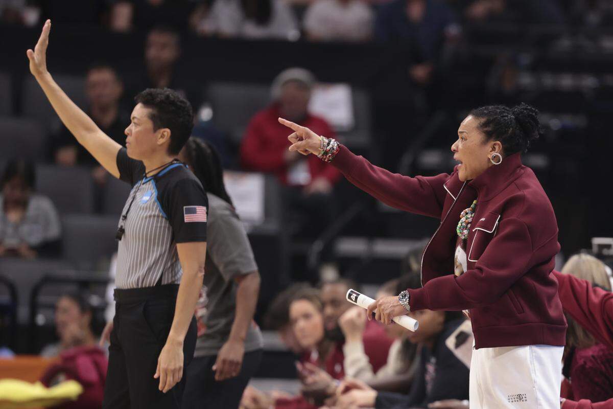 South Carolina's head coach Dawn Staley talks with her team during the first half of action of their Sweet 16 women's basketball game against Oklahoma at Golden 1 Arena on Saturday, March 28, 2026.