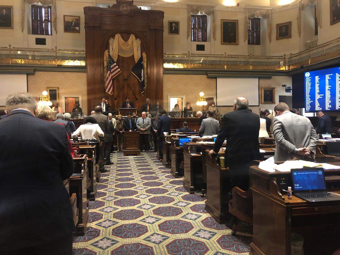 The South Carolina House stands in a moment of silence and in prayer on Thursday, April 8, 2021, for the York County mass shooting victims.