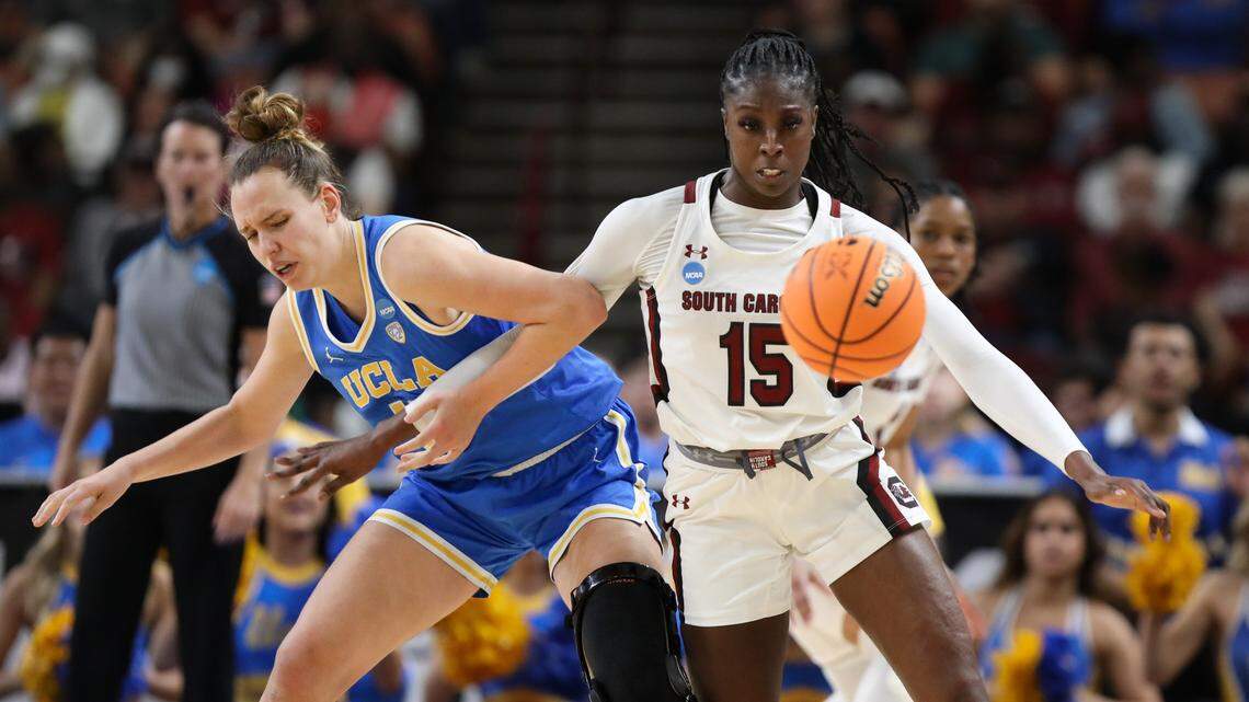 South Carolina Gamecocks forward Laeticia Amihere (15) and UCLA Bruins forward Emily Bessoir (11) scramble for a loose ball during the Sweet 16 round of the 2023 NCAA Tournament at Bon Secours Wellness Arena in Greenville on Saturday, March 25, 2023.