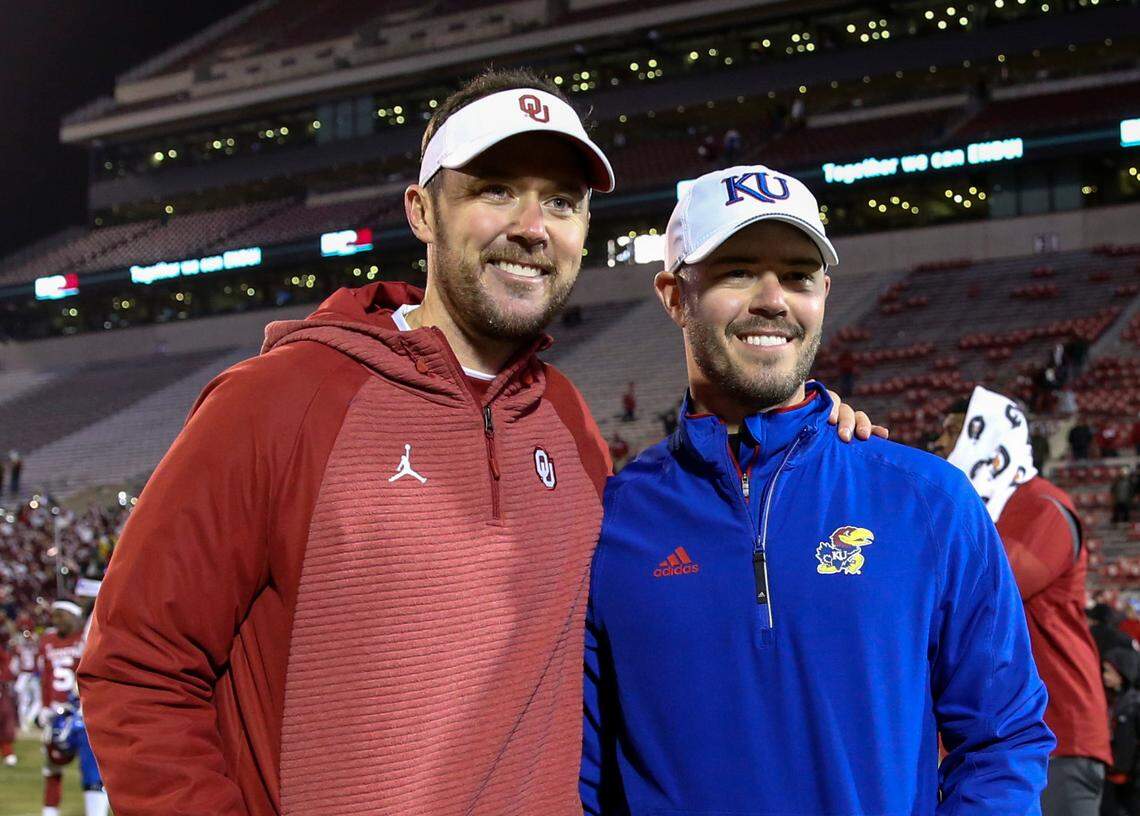 From Nov 17, 2018: Lincoln Riley (left), then Oklahoma Sooners head coach,g takes a photo with brother Garrett Riley, then an assistant with the Kansas Jayhawks, after their game at Oklahoma Memorial Stadium.