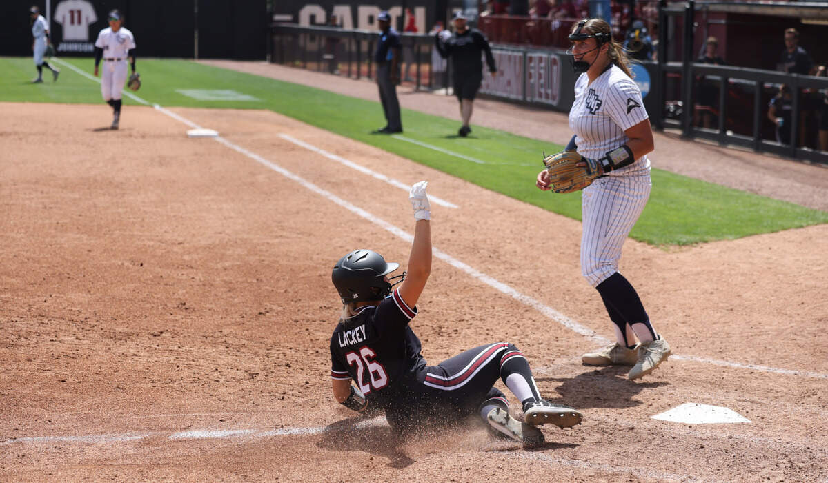 South Carolina outfielder Chloe Lackey (26) scores during the Gamecocks’ game against North Florida at Beckham Field in Columbia on Saturday, May 17, 2025.